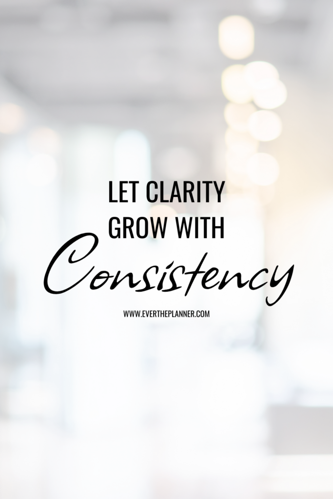 Minimalist Pinterest quote pin with the text: “Let clarity grow with consistency.” Soft bokeh background with warm lighting creates a calming, focused mood.